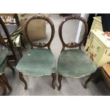 Set of four Victorian walnut balloon back chairs.