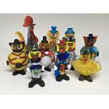 A collection of Murano glass clowns and other glas