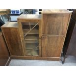 An Art Deco walnut cabinet fitted with a glazed do