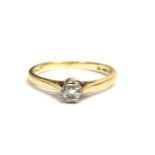 An 18ct gold solitaire ring, set with a singular d