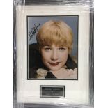 A framed and glazed photograph of Shirley Maclaine