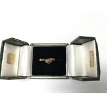 A 9ct gold ring set with coloured stones. Size app