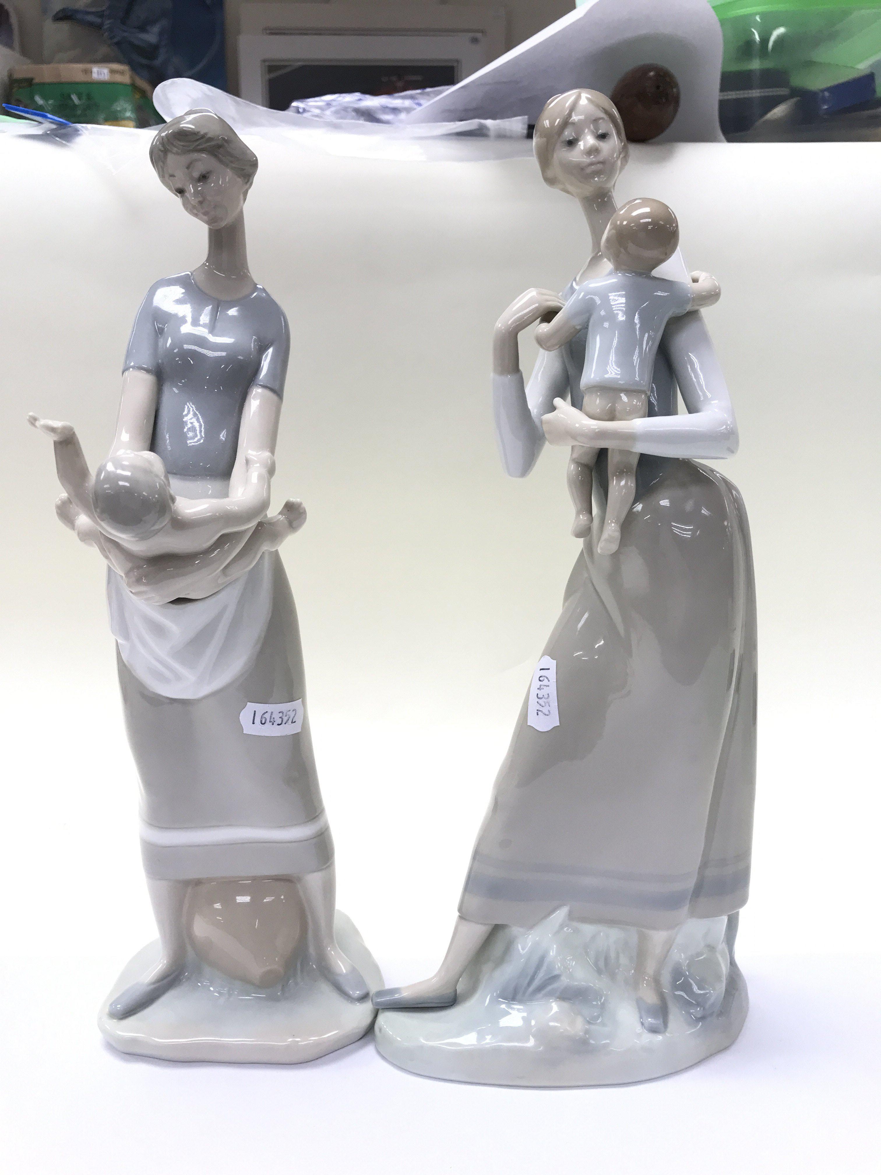 Two Lladro figures (one damaged).