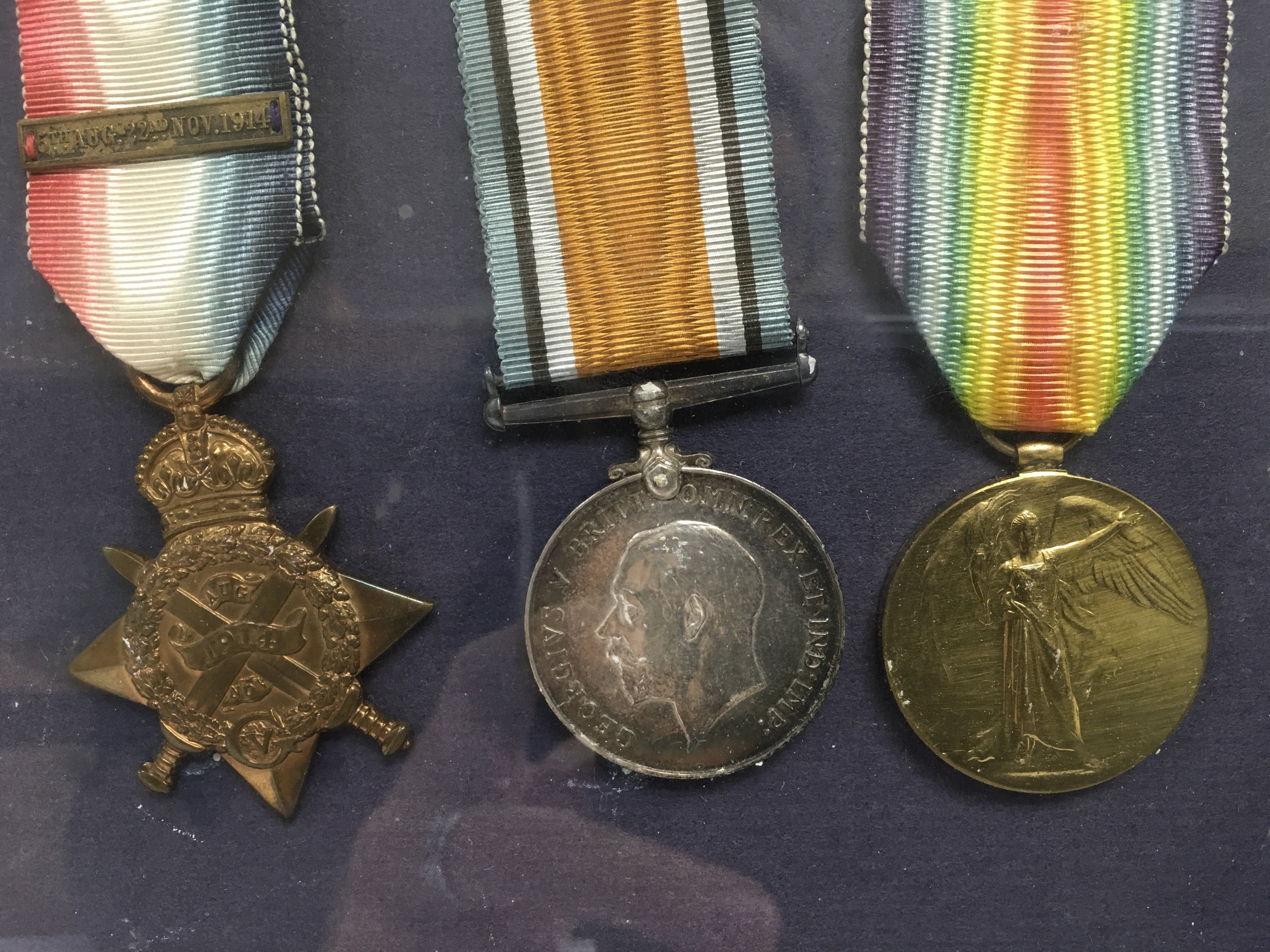 A framed and glazed montage of WW1 medals and a de - Image 2 of 2