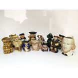 A collection of eleven ceramic caricature drinking