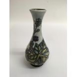 A Moorcroft solifleur 'blackberry' pattern bud vas