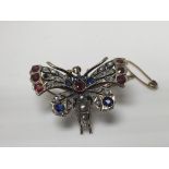 A Victorian butterfly brooch inset with old cut di
