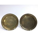 A pair of brass trench art dishes engraved with 'T