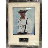 A framed and glazed photograph of Harrison Ford wi