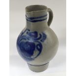 A 19th century Continental stoneware jug decorated