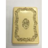 A carved ivory card case, approx 7.5cm x 11cm.