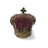 A pin cushion in the form of a crown.