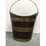 A Georgian mahogany oval peat bucket brass bound
