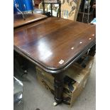 A Victorian mahogany dining table the square top o
