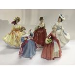 Five Royal Doulton figures of ladies.