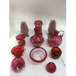 A small group of various cranberry glass including