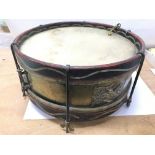 A military snare drum with a badge to the side of