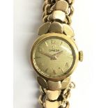 A ladies 18ct gold Omega automatic wristwatch. Thi