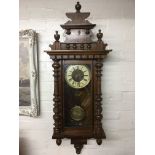 A mahogany cased 8 day wall clock.