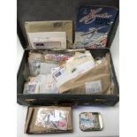 A small suitcase containing a collection of World postage stamps.