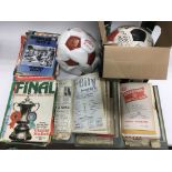 A collection of football memorabilia including shirts, programs and ephemera.