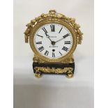 A regency style mantle clock the gilt case inset with enamel dial and Roman numerals maker tupman Lo
