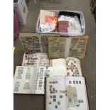 A large collection of worldwide stamps including albums and loose examples