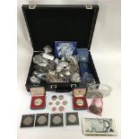 A briefcase containing circulated world coinage and notes