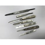 A collection of 7 mainly silver fruit knives.