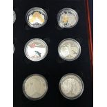 A cased set of 12 '5 Kwacha' coins depicting a 'Journey Through Africa'.