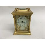 A French brass carriage clock with Japanese Aesthetic influence the white dial with Arabic