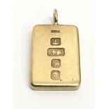 A solid gold ingot pendant stamped 375, maker JLK. Total weight approximately grams. Approx 25mm x