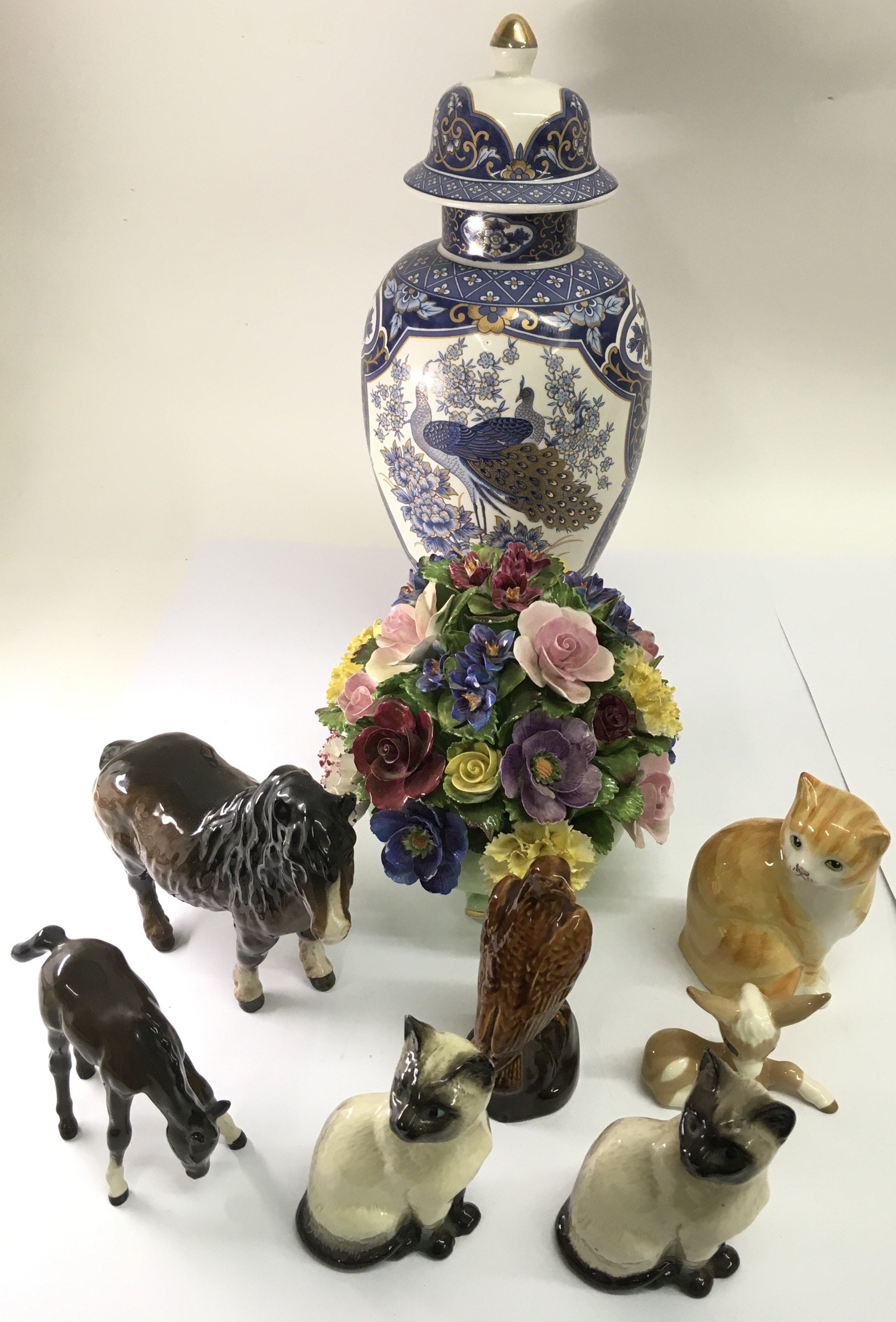 A group of Beswick and other animal models, a ceramic post and lidded peacock vase