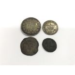 An unusual 1701 coin, an emergency 1812 bank token for 1s 6d and two other coins.