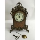 A walnut veneer Lenskirsch mantel clock with eight day movement and gilt metal mounts.Approx 31cm