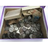 A box of used circulated coinage.