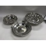 A group of 3 silver plated dishes with handles