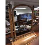 A large Victorian mahogany toilet mirror the arched plate flanked with turned column