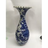 A large Japanese blue and white vase decorated with flowers foliage 54 cm