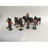 A collection of model soilders including lead britains