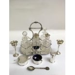 A London silver Harrods condiment set, two small silver bud vases and a silver plated bottle