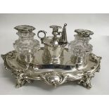 Another fine quality Victorian silver inkwell stand of scrolled form containing two cut glass ink