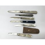 A collection of 6 mainly silver fruit knives.