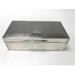 An Art Deco silver cigarette box.