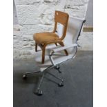 A retro child's shaped plywood chair and a modern chrome swivel/office armchair