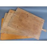 Four large wooden pizza or cheese boards,