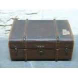 A vintage ash bound trunk with leather handles,