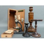 A cased microscope, cast metal stand or tazza,