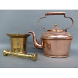 A brass pestle and mortar and a copper kettle
