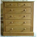 A large pine chest of two drawers over four graduated drawers,